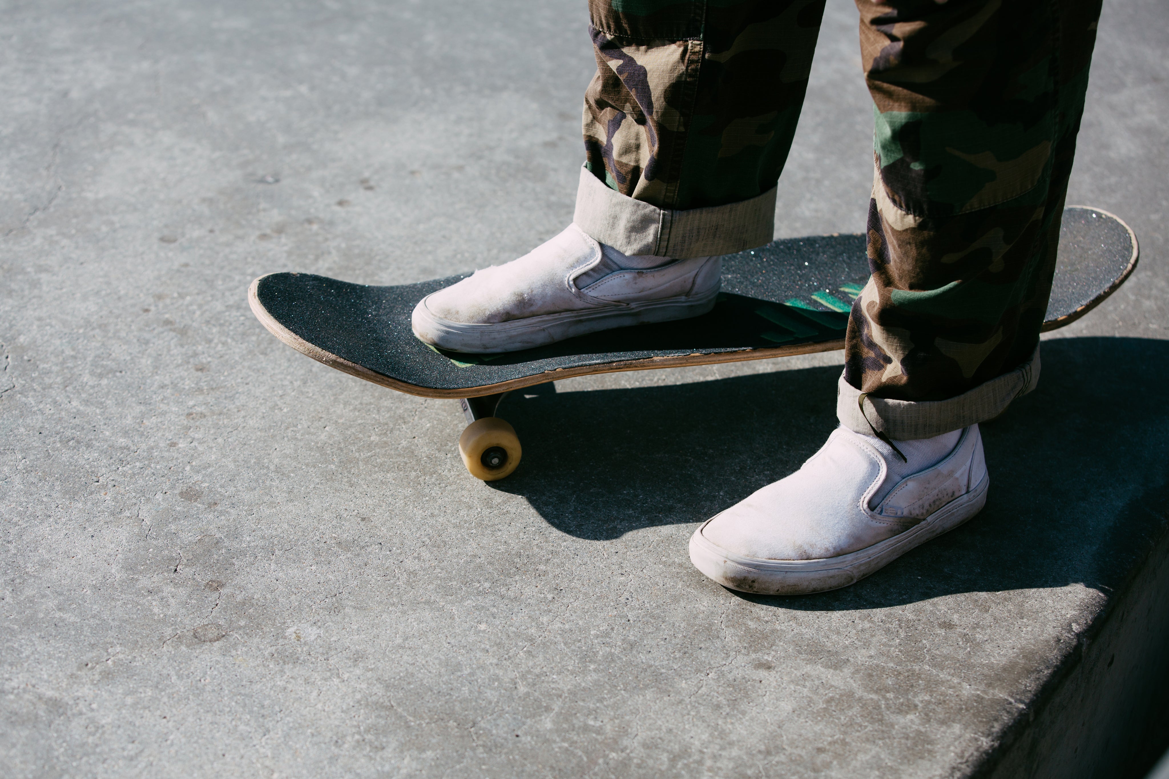 skater-standing-with-one-foot-on-the-board.jpg